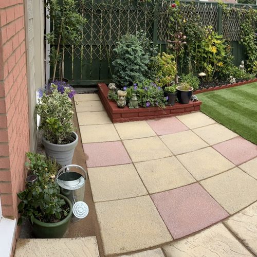 Mates Rates Pro Cleaning patio with artificial grass
